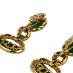 Boucles D'oreilles Pendantes DAVID WEBB Feuilles En Or Jaune, émeraudes Et Diamants 11 Boucles D'oreilles Pendantes DAVID WEBB Feuilles En Or Jaune, émeraudes Et Diamants -Castafiore Boutique avant premiere boucles doreilles pendantes david webb feuilles en or jaune emeraudes et diamants 737584