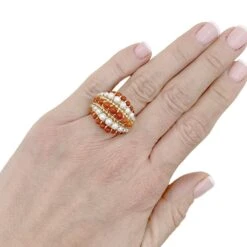 Miller Bague Dôme VAN CLEEF & ARPELS "Twist" En Or Jaune, Corail Et Perles -Castafiore Boutique bague dome van cleef arpels twist or jaune corail perles 357270