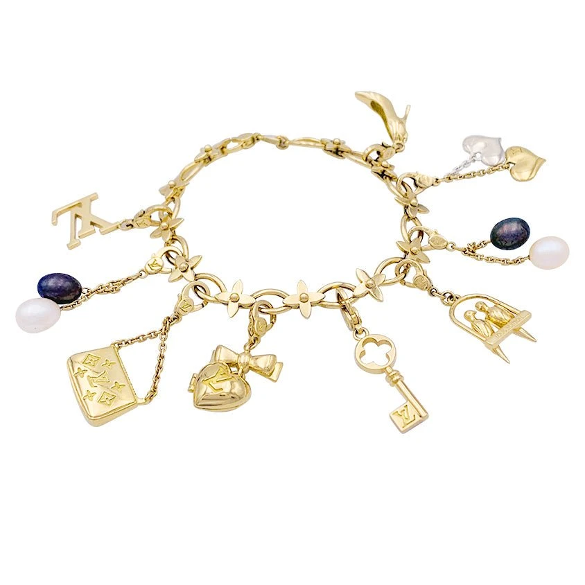 Miller Bracelet Louis Vuitton, "Idylle",breloques, Or Jaune, Or Blanc, Perles. 1 Miller Bracelet Louis Vuitton, "Idylle",breloques, Or Jaune, Or Blanc, Perles.